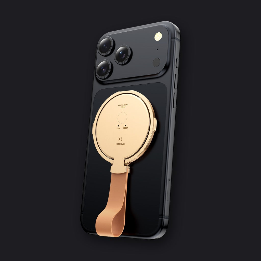 LETSLIVO One Champagne Gold attached to a phone